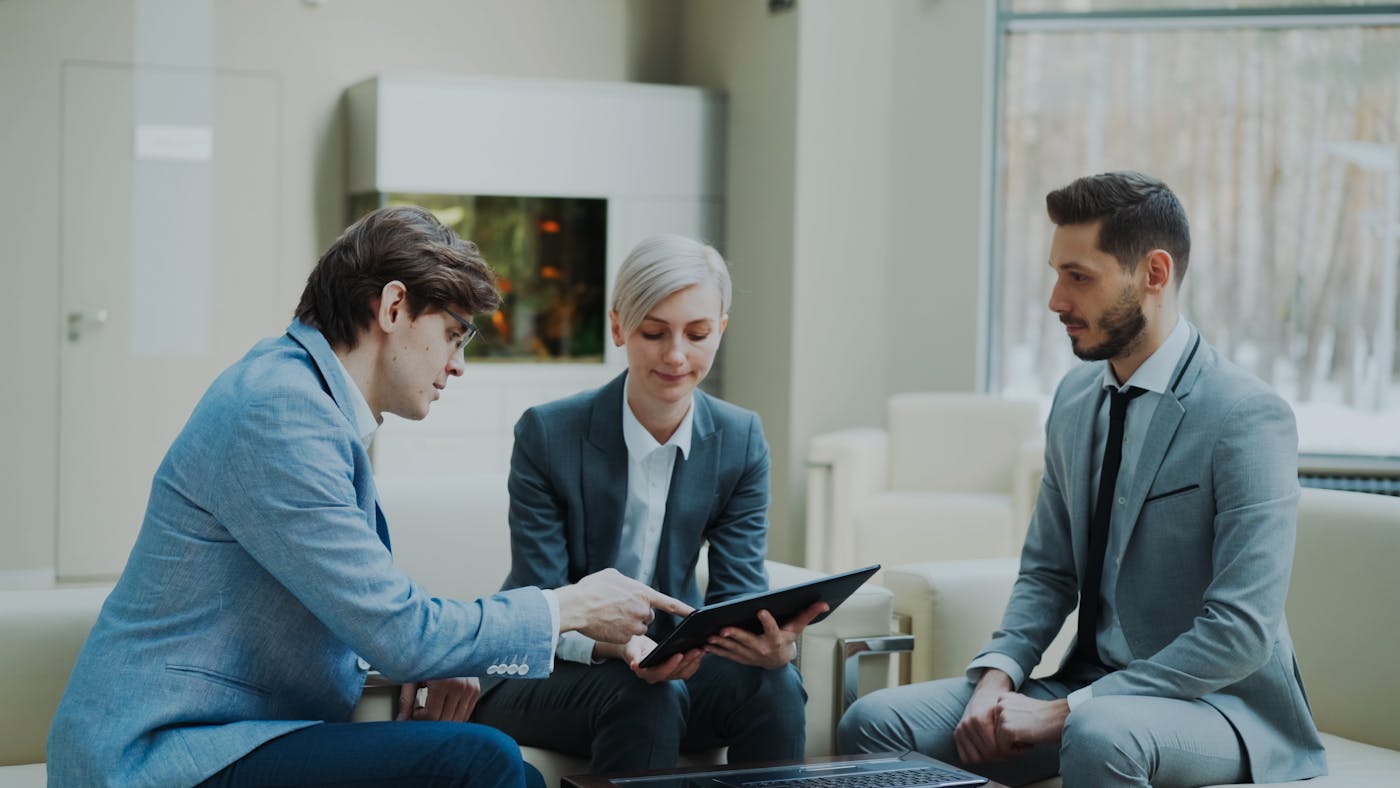 Advisory team reviewing materials during a premium office presentation
